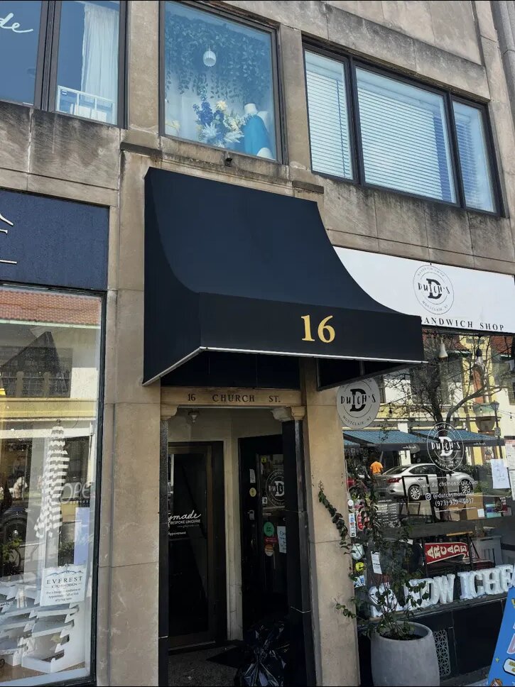 Freshly cleaned black storefront awning