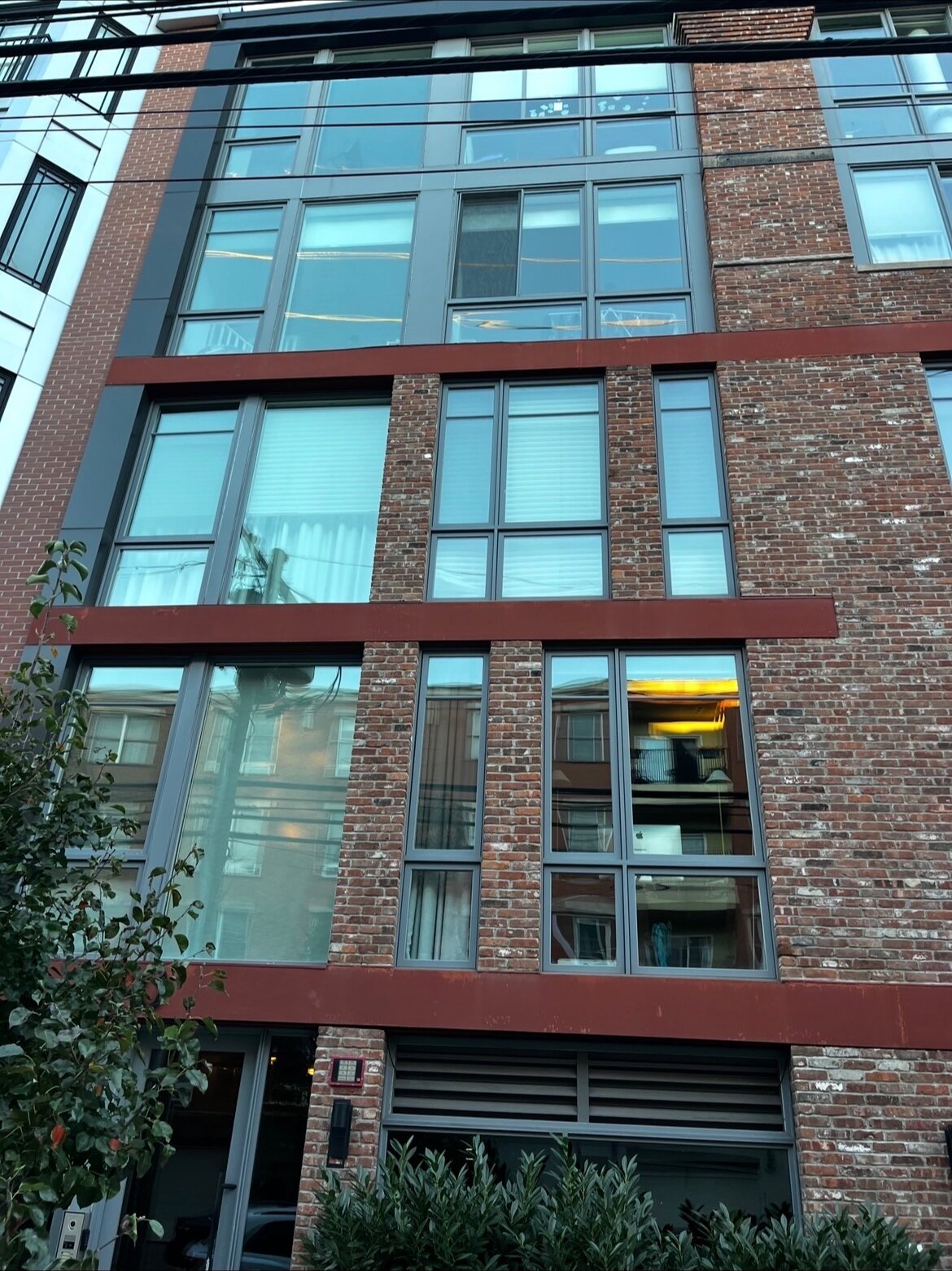 Five story condo building with freshly cleaned windows