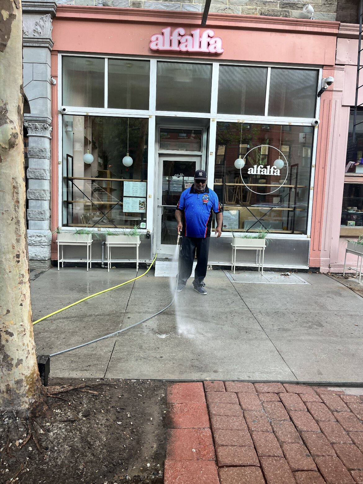 Premier Power Washerz crew cleaning the sidewalk outside Alfalfa in Hoboken