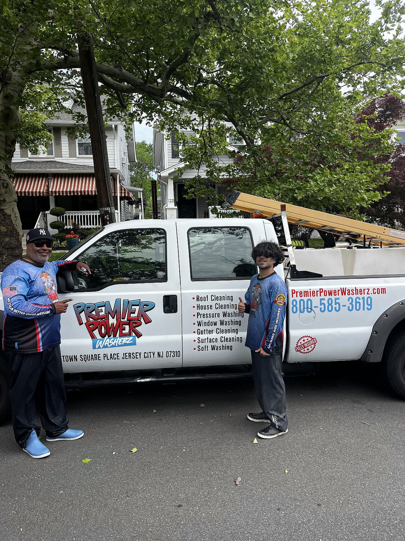 The Premier Power Washerz crew with their truck on a Hudson County street