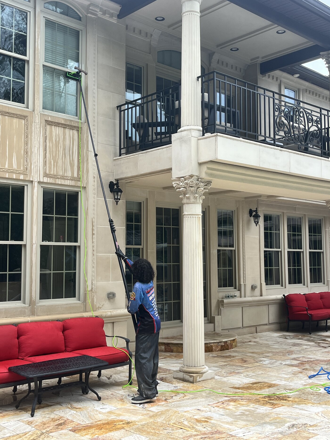Clean cast stone fence pillar cap and ball finial after soft washing