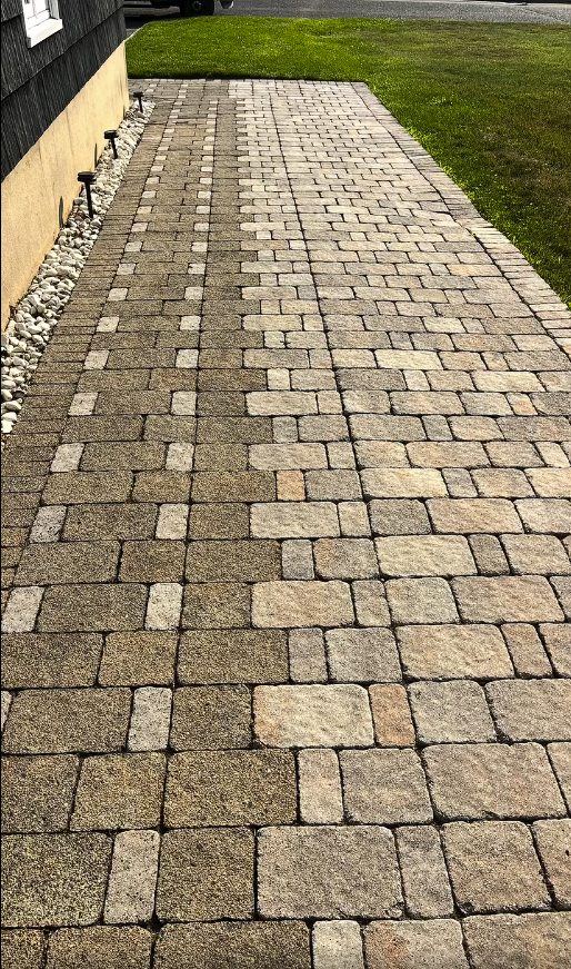 A paver walkway in Point Pleasant NJ with its tan and brown color restored after cleaning, sanding, and sealing