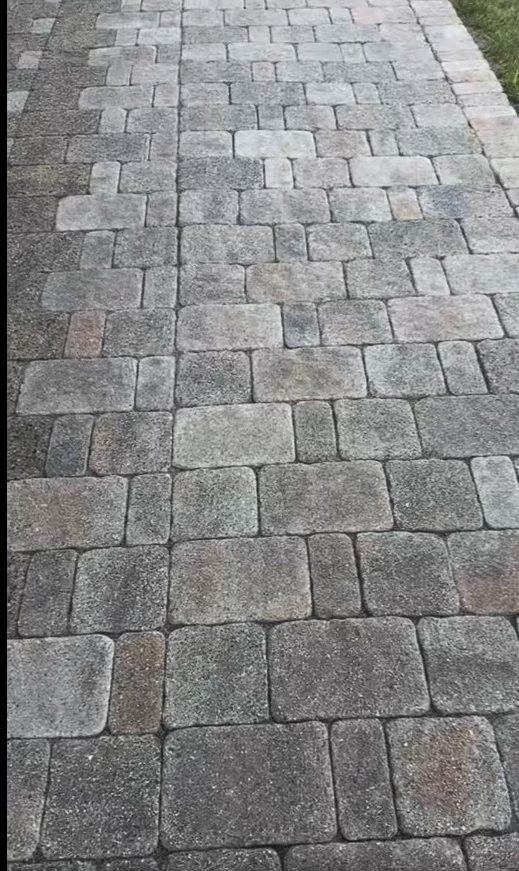 The paver walkway before restoration, gray and washed out with thinning joints